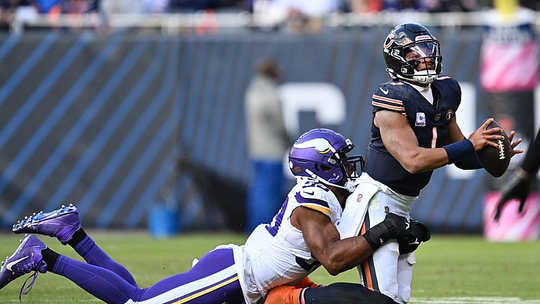 Oct 15, 2023; Chicago, Illinois, USA;  Chicago Bears quarterback Justin Fields (1) is sacked by Minnesota Vikings linebacker Danielle Hunter (99) in the second half at Soldier Field. Mandatory Credit: Jamie Sabau-USA TODAY Sports