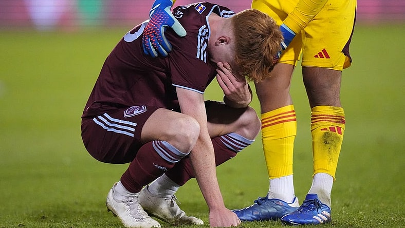 Oct 15, 2023; Denver, CO, USA; Colorado Rapids goalkeeper Abe Rodriguez (26) consoles midfielder Oliver Larraz (18) following the loss to the Austin FC II following a shoot out in the Western Conference Final at Dick's Sporting Goods Park. Mandatory Credit: Ron Chenoy-USA TODAY Sports