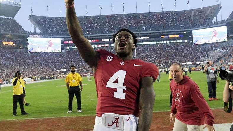 Oct 21, 2023; Tuscaloosa, Alabama, USA;  Alabama Crimson Tide quarterback Jalen Milroe (4) celebrates with fans after the Crimson Tide defeated Tennessee 34-20 at Bryant-Denny Stadium. Mandatory Credit: Gary Cosby Jr.-USA TODAY Sports