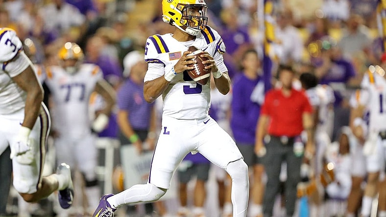 Oct 21, 2023; Baton Rouge, Louisiana, USA; LSU Tigers quarterback Jayden Daniels (5) looks to pass against the Army Black Knights during the first half at Tiger Stadium. Mandatory Credit: Danny Wild-USA TODAY Sports