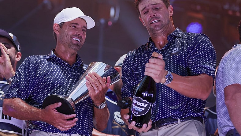 Oct 22, 2023; Doral, Florida, USA; Crushers GC team captain Bryson Dechambeau and Charles Howell III celebrate winning the team championship during the final round of the LIV Golf Miami golf tournament at Trump National Doral. Mandatory Credit: Sam Navarro-USA TODAY Sports