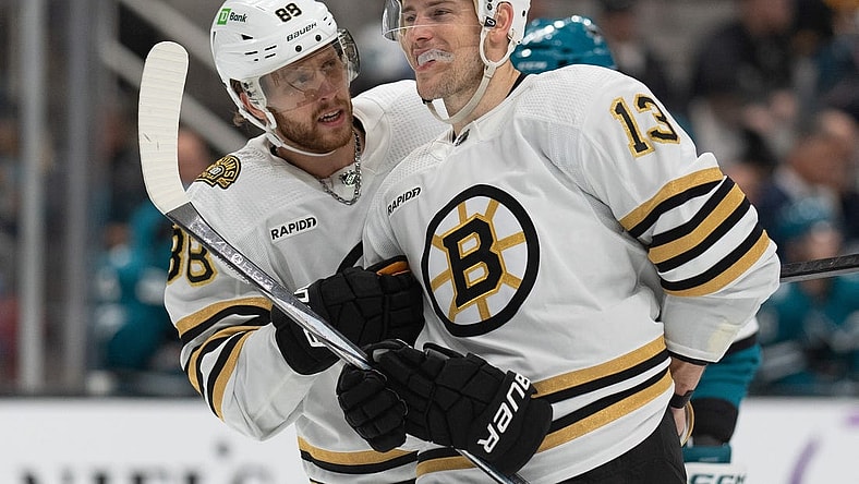 Oct 19, 2023; San Jose, California, USA;  Boston Bruins right wing David Pastrnak (88) converses with center Charlie Coyle (13) during the second period against the San Jose Sharks at SAP Center at San Jose. Mandatory Credit: Stan Szeto-USA TODAY Sports