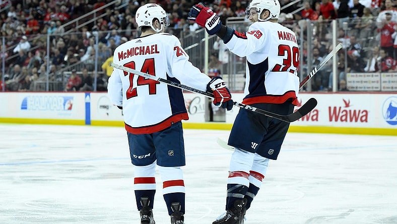 Oct 25, 2023; Newark, New Jersey, USA; Washington Capitals center Connor McMichael (24) celebrates with Washington Capitals right wing Anthony Mantha (39) after scoring a goal against the New Jersey Devils during the third period at Prudential Center. Mandatory Credit: John Jones-USA TODAY Sports