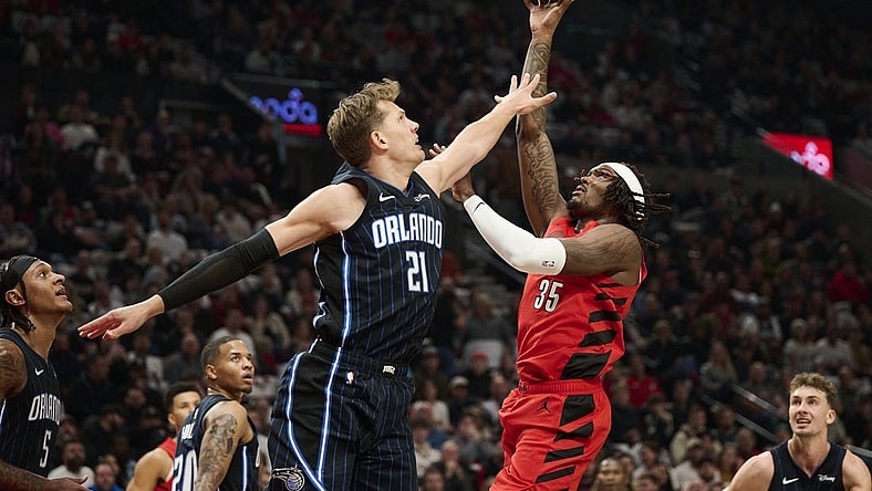 Oct 27, 2023; Portland, Oregon, USA; Portland Trail Blazers center Robert Williams III (35) shoots a basket during the first half against Orlando Magic center Moritz Wagner (21) at Moda Center. Mandatory Credit: Troy Wayrynen-USA TODAY Sports