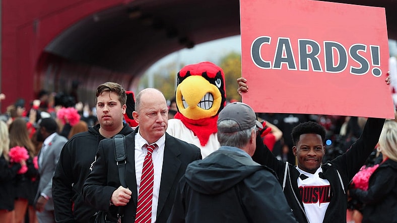 U of L head football coach Jeff Brohm enters the stadium during the Cards March ahead of their game against Duke at the L&N Stadium in Louisville, Ky. on Oct. 28, 2023.