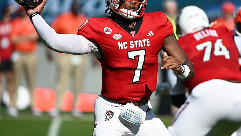 Oct 28, 2023; Raleigh, North Carolina, USA; North Carolina State Wolfpack quarterback MJ Morris (7) throws a pass during the first half against the Clemson Tigers at Carter-Finley Stadium. Mandatory Credit: Rob Kinnan-USA TODAY Sports