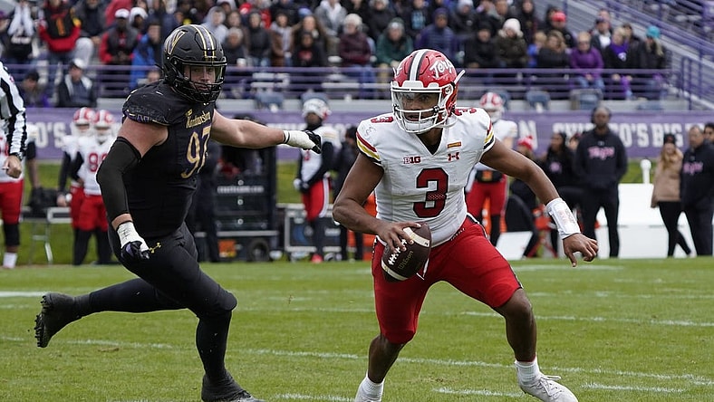 Oct 28, 2023; Evanston, Illinois, USA; Northwestern Wildcats defensive lineman Sean McLaughlin (97) chases Maryland Terrapins quarterback Taulia Tagovailoa (3) during the second half at Ryan Field. Mandatory Credit: David Banks-USA TODAY Sports