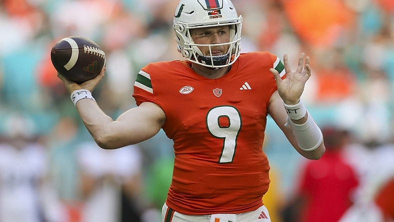Oct 28, 2023; Miami Gardens, Florida, USA; Miami Hurricanes quarterback Tyler Van Dyke (9) throws the football against the Virginia Cavaliers during the second quarter at Hard Rock Stadium. Mandatory Credit: Sam Navarro-USA TODAY Sports