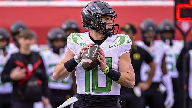 Oct 28, 2023; Salt Lake City, Utah, USA; Oregon Ducks quarterback Bo Nix (10) drops back to pass against the Utah Utes during the first half at Rice-Eccles Stadium. Mandatory Credit: Christopher Creveling-USA TODAY Sports