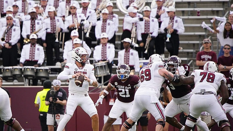 Oct 28, 2023; College Station, Texas, USA; South Carolina Gamecocks quarterback Spencer Rattler (7) looks for a pass against Texas A&M Aggies during the first quarter at Kyle Field. Mandatory Credit: Dustin Safranek-USA TODAY Sports