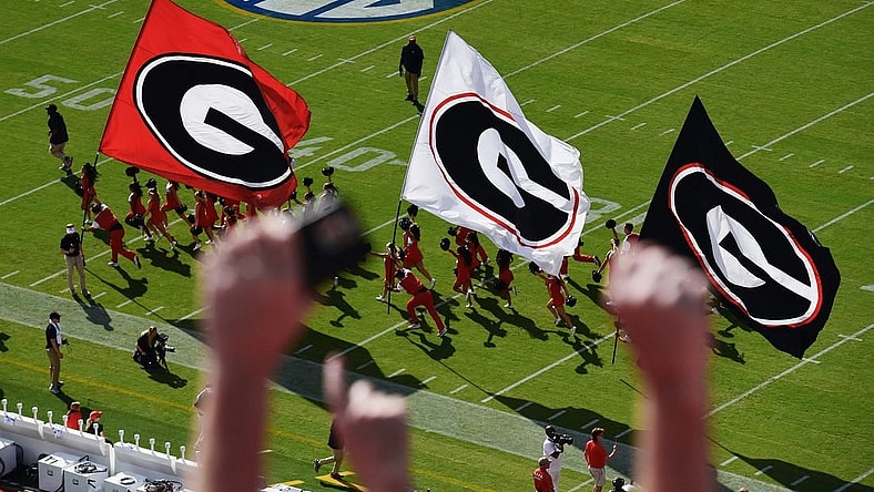 The Bulldog cheerleaders run out on the field ahead of the team before the start of the annual Florida vs Georgia football game at EverBank Stadium in Jacksonville, FL, Saturday, October 27, 2023. [Bob Self/Florida Times-Union]