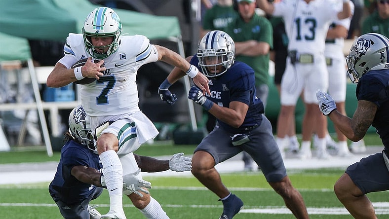 Oct 28, 2023; Houston, Texas, USA; Tulane Green Wave quarterback Michael Pratt (7) rushes for a first down against the Tulane Green Wave in the first half at Rice Stadium. Mandatory Credit: Thomas Shea-USA TODAY Sports