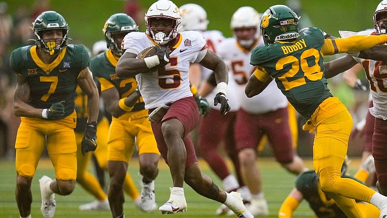 Oct 28, 2023; Waco, Texas, USA;  Iowa State Cyclones running back Cartevious Norton (5) runs past Baylor Bears safety Devyn Bobby (28) for a touchdown during the second half at McLane Stadium. Mandatory Credit: Chris Jones-USA TODAY Sports