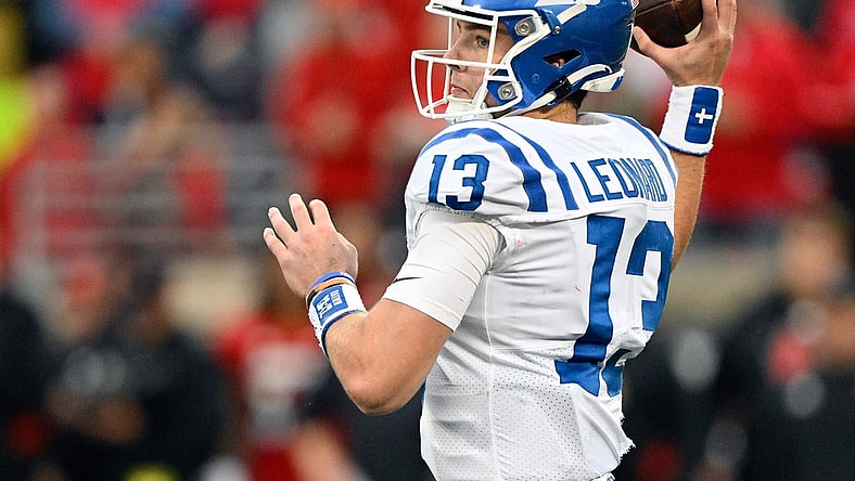 Oct 28, 2023; Louisville, Kentucky, USA;  Duke Blue Devils quarterback Riley Leonard (13) looks to pass the ball against the Louisville Cardinals during the second half at L&N Federal Credit Union Stadium. Mandatory Credit: Jamie Rhodes-USA TODAY Sports