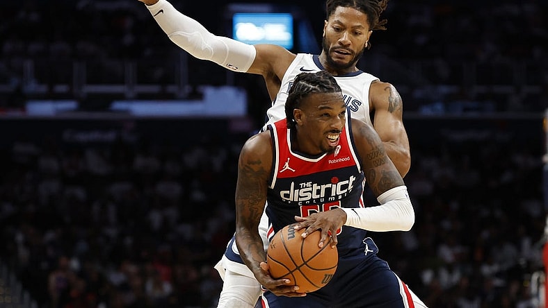 Oct 28, 2023; Washington, District of Columbia, USA; Washington Wizards guard Delon Wright (55) steals a pass intended for Memphis Grizzlies guard Derrick Rose (23) in the fourth quarter at Capital One Arena. Mandatory Credit: Geoff Burke-USA TODAY Sports