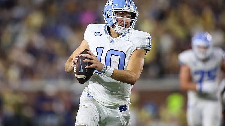 Oct 28, 2023; Atlanta, Georgia, USA; North Carolina Tar Heels quarterback Drake Maye (10) runs the ball against the Georgia Tech Yellow Jackets in the second half at Bobby Dodd Stadium at Hyundai Field. Mandatory Credit: Brett Davis-USA TODAY Sports