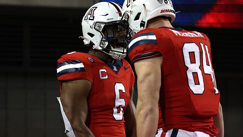 Oct 28, 2023; Tucson, Arizona, USA; Arizona Wildcats running back Michael Wiley #6 celebrates a touchdown with tight end Tanner McLachlan #84 during the second half at Arizona Stadium. Mandatory Credit: Zachary BonDurant-USA TODAY Sports
