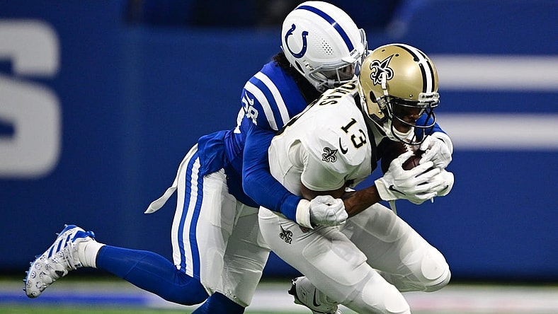 Oct 29, 2023; Indianapolis, Indiana, USA; Indianapolis Colts cornerback Tony Brown (38) tackles New Orleans Saints wide receiver Michael Thomas (13) during the first quarter at Lucas Oil Stadium. Mandatory Credit: Marc Lebryk-USA TODAY Sports