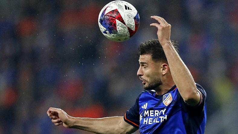 Oct 29, 2023; Cincinnati, OH, USA; FC Cincinnati defender Matt Miazga (21) heads the ball against the New York Red Bulls during the first half of game one in a round one match of the 2023 MLS Cup Playoffs at TQL Stadium. Mandatory Credit: Katie Stratman-USA TODAY Sports