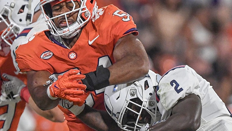 Sep 16, 2023; Clemson, South Carolina; Clemson linebacker Jeremiah Trotter Jr. (54) tackles Florida Atlantic running back Zuberi Mobley (2) the third quarter with Florida Atlantic at Memorial Stadium. Mandatory Credit: Ken Ruinard-USA TODAY NETWORK