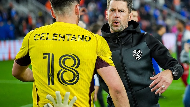 Oct 29, 2023; Cincinnati, OH, USA; FC Cincinnati head coach Pat Noonan hugs goalkeeper Roman Celentano (18) on the field after his team defeats the New York Red Bulls in game one in a round one match of the 2023 MLS Cup Playoffs at TQL Stadium. Mandatory Credit: Aaron Doster-USA TODAY Sports