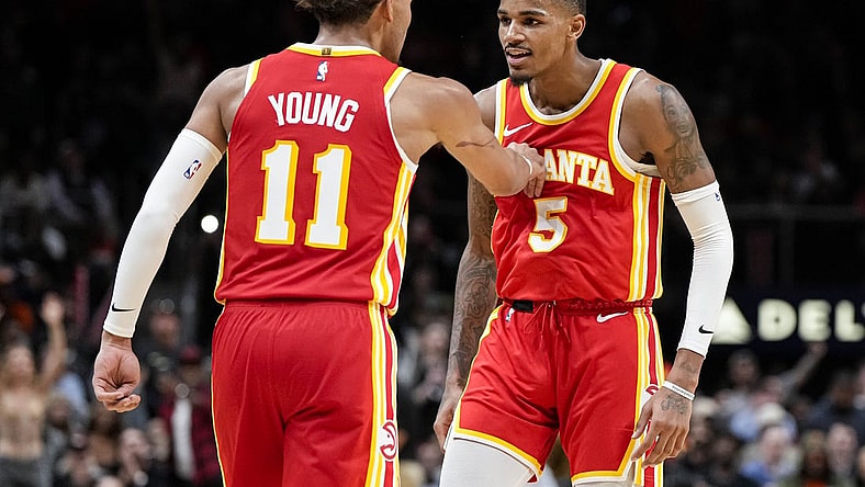 Oct 30, 2023; Atlanta, Georgia, USA; Atlanta Hawks guards Trae Young (11) and Dejounte Murray (5) react after a basket against the Minnesota Timberwolves during the second half at State Farm Arena. Mandatory Credit: Dale Zanine-USA TODAY Sports