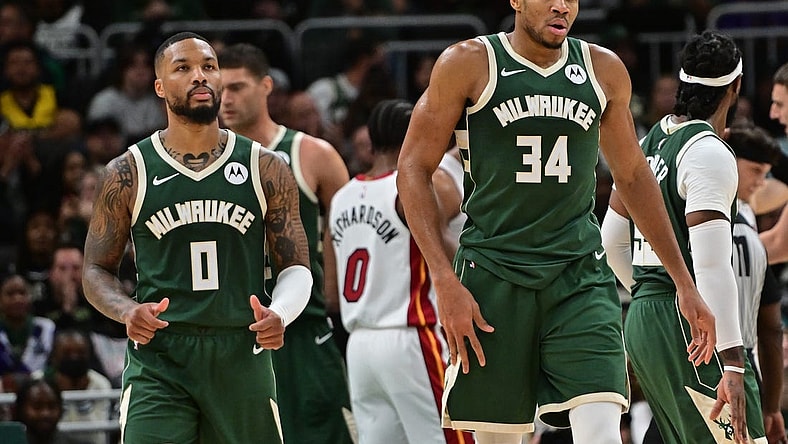 Oct 30, 2023; Milwaukee, Wisconsin, USA; Milwaukee Bucks forward Giannis Antetokounmpo (34) and guard Damian Lillard (0) looks on during a timeout in the fourth quarter against the Miami Heat at Fiserv Forum. Mandatory Credit: Benny Sieu-USA TODAY Sports