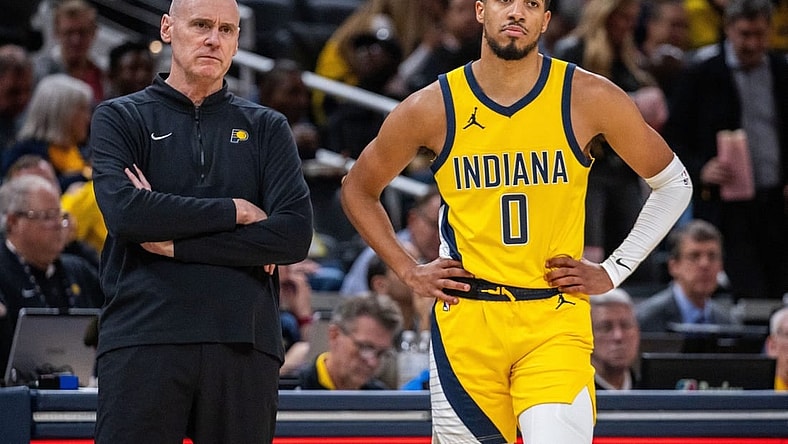 Oct 30, 2023; Indianapolis, Indiana, USA; Indiana Pacers head coach Rick Carlisle and guard Tyrese Haliburton (0) look on in the second half against the Chicago Bulls at Gainbridge Fieldhouse. Mandatory Credit: Trevor Ruszkowski-USA TODAY Sports