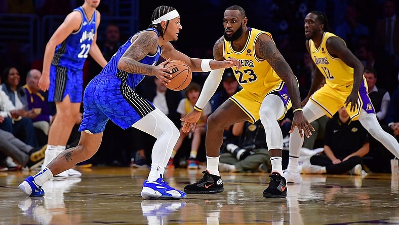 Oct 30, 2023; Los Angeles, California, USA; Orlando Magic forward Paolo Banchero (5) moves the all against Los Angeles Lakers forward LeBron James (23) during the second half at Crypto.com Arena. Mandatory Credit: Gary A. Vasquez-USA TODAY Sports