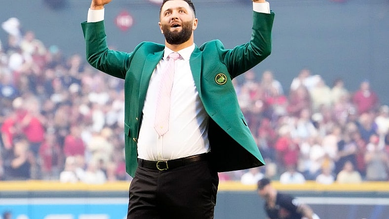 Spanish professional golfer and Arizona State University alumnus Jon Rahm reacts after throwing out the ceremonial first pitch before Game 4 of the World Series between the Arizona Diamondbacks and Texas Rangers at Chase Field in Phoenix on October 31, 2023. The DBacks lost to the Rangers 11-7, putting the Ranger at 3-1 in the World Series.