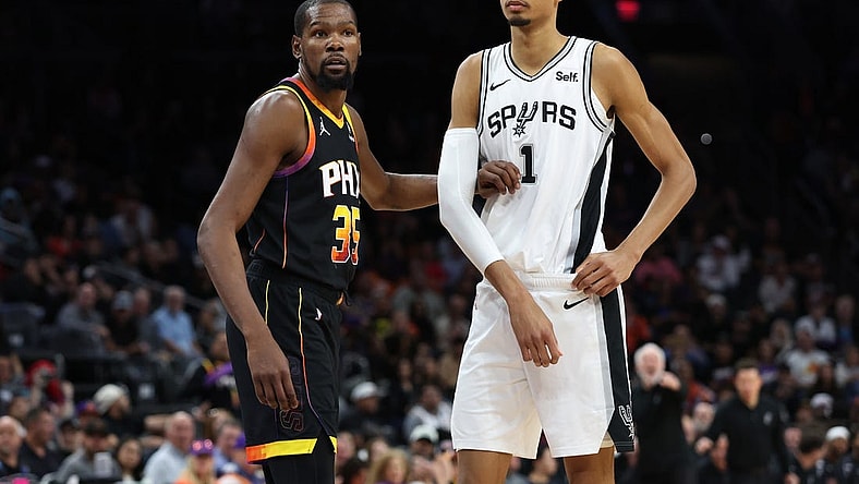Oct 31, 2023; Phoenix, Arizona, USA; Phoenix Suns forward Kevin Durant #35 guards San Antonio Spurs center Victor Wembanyama #1 during the second half at Footprint Center. Mandatory Credit: Zachary BonDurant-USA TODAY Sports