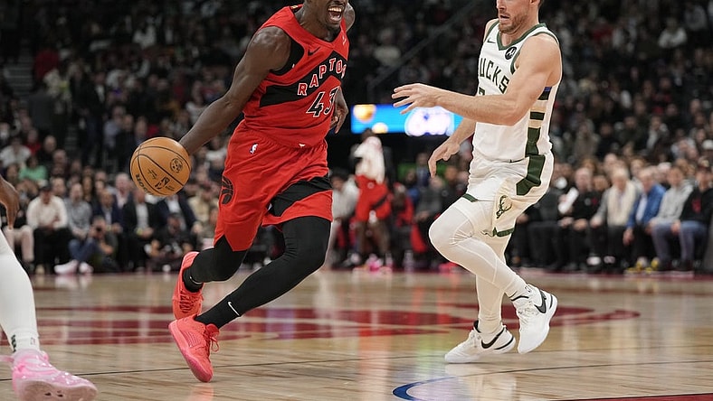 Nov 1, 2023; Toronto, Ontario, CAN; Toronto Raptors forward Pascal Siakam (43) drives to the net past Milwaukee Bucks guard Pat Connaughton (24) during the first half at Scotiabank Arena. Mandatory Credit: John E. Sokolowski-USA TODAY Sports