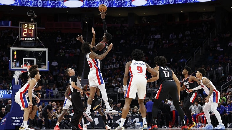 Nov 1, 2023; Detroit, Michigan, USA; Portland Trail Blazers center Deandre Ayton (2) wins the tipoff over Detroit Pistons forward Marvin Bagley III (35) in the first half at Little Caesars Arena. Mandatory Credit: Rick Osentoski-USA TODAY Sports