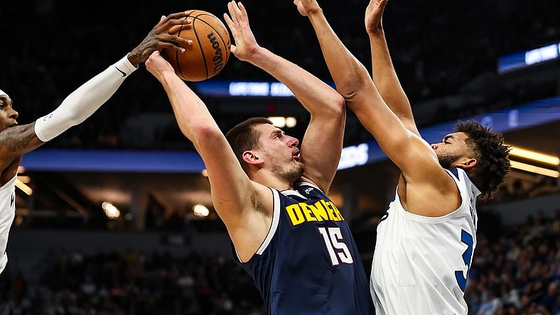 Nov 1, 2023; Minneapolis, Minnesota, USA; Minnesota Timberwolves forward Jaden McDaniels (3) blocks a shot by Denver Nuggets center Nikola Jokic (15) during the first half at Target Center. Mandatory Credit: Matt Krohn-USA TODAY Sports