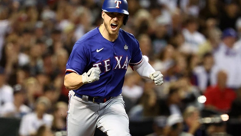 Nov 1, 2023; Phoenix, Arizona, USA; Texas Rangers catcher Mitch Garver (18) reacts after hitting a RBI single against the Arizona Diamondbacks during the sixth inning in game five of the 2023 World Series at Chase Field. Mandatory Credit: Mark J. Rebilas-USA TODAY Sports