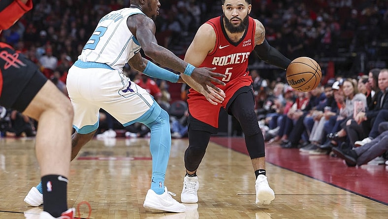 Nov 1, 2023; Houston, Texas, USA; Houston Rockets guard Fred VanVleet (5) controls the ball as Charlotte Hornets guard Terry Rozier (3) defends during the third quarter at Toyota Center. Mandatory Credit: Troy Taormina-USA TODAY Sports