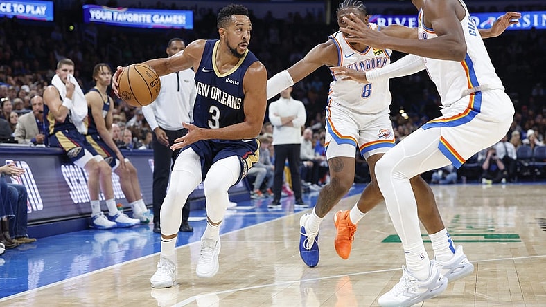 Nov 1, 2023; Oklahoma City, Oklahoma, USA; New Orleans Pelicans guard CJ McCollum (3) drives down the court against Oklahoma City Thunder forward Jalen Williams (8) and guard Shai Gilgeous-Alexander (2) during the second half at Paycom Center. New Orleans won 110-106. Mandatory Credit: Alonzo Adams-USA TODAY Sports