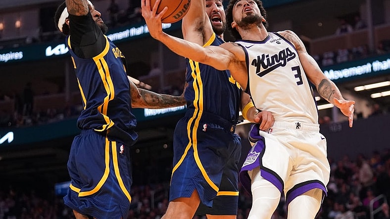 Nov 1, 2023; San Francisco, California, USA; Sacramento Kings guard Chris Duarte (3) is fouled by Golden State Warriors guard Klay Thompson (11) in the second quarter at the Chase Center. Mandatory Credit: Cary Edmondson-USA TODAY Sports.