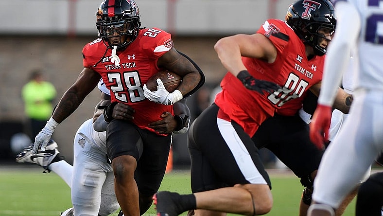 Texas Tech's running back Tahj Brooks (28) runs with the ball against TCU in a Big 12 football game, Thursday, Nov. 2, 2023, at Jones AT&T Stadium.