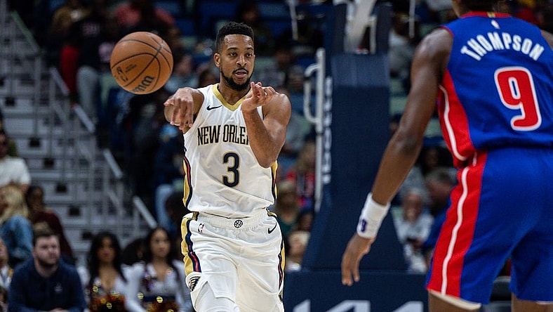 Nov 2, 2023; New Orleans, Louisiana, USA;  New Orleans Pelicans guard CJ McCollum (3) passes around Detroit Pistons forward Ausar Thompson (9) during the first half at the Smoothie King Center. Mandatory Credit: Stephen Lew-USA TODAY Sports