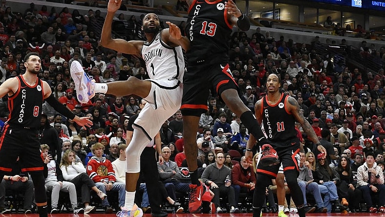 Nov 3, 2023; Chicago, Illinois, USA; Chicago Bulls forward Torrey Craig (13) defends against a shot by Brooklyn Nets forward Mikal Bridges (1) during the first half at the United Center. Mandatory Credit: Matt Marton-USA TODAY Sports
