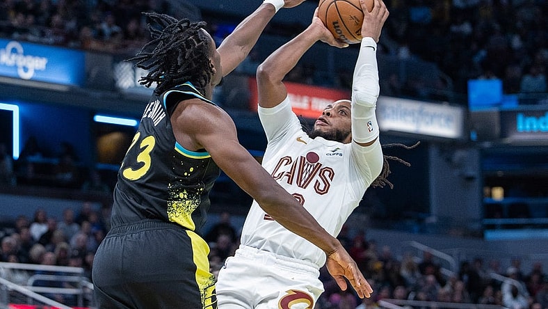 Nov 3, 2023; Indianapolis, Indiana, USA; Cleveland Cavaliers guard Darius Garland (10) shoots while Indiana Pacers forward Aaron Nesmith (23) defends in the second half at Gainbridge Fieldhouse. Mandatory Credit: Trevor Ruszkowski-USA TODAY Sports