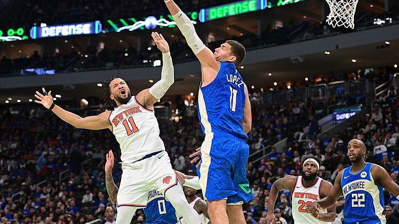 Nov 3, 2023; Milwaukee, Wisconsin, USA; New York Knicks guard Jalen Brunson (11) takes a shot against Milwaukee Bucks center Brook Lopez (11) in the fourth quarter at Fiserv Forum. Mandatory Credit: Benny Sieu-USA TODAY Sports