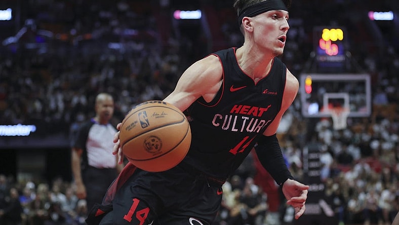 Nov 3, 2023; Miami, Florida, USA; Miami Heat guard Tyler Herro (14) drives to the basket against the Washington Wizards during the fourth quarter at Kaseya Center. Mandatory Credit: Sam Navarro-USA TODAY Sports