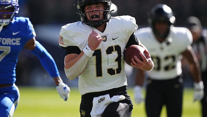 Nov 4, 2023; Denver, Colorado, USA; Army Black Knights quarterback Bryson Daily (13) carries for a 63 yard touchdown in the first quarter against the Air Force Falcons at Empower Field at Mile High. Mandatory Credit: Ron Chenoy-USA TODAY Sports