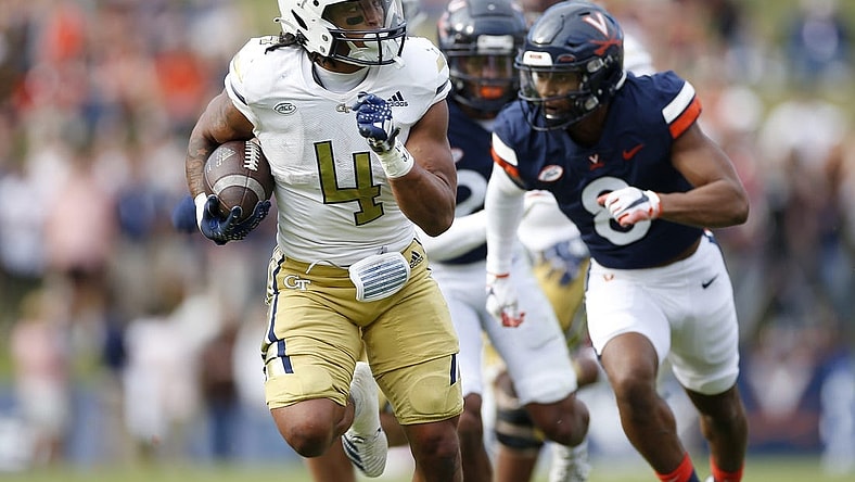 Nov 4, 2023; Charlottesville, Virginia, USA; Georgia Tech Yellow Jackets running back Dontae Smith (4) carries the to score a touchdown during the first half against the Virginia Cavaliers at Scott Stadium. Mandatory Credit: Amber Searls-USA TODAY Sports
