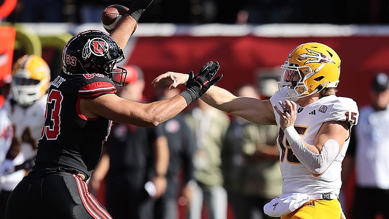 Nov 4, 2023; Salt Lake City, Utah, USA; Arizona State Sun Devils quarterback Jacob Conover (15) has pass deflected by Utah Utes defensive end Jonah Elliss (83) in the second quarter at Rice-Eccles Stadium. Mandatory Credit: Rob Gray-USA TODAY Sports