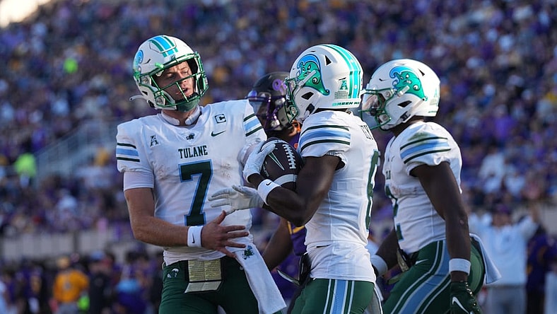 Nov 4, 2023; Greenville, North Carolina, USA; Tulane Green Wave wide receiver Lawrence Keys III (6) is congratulated by quarterback Michael Pratt (7) after his touchdown during the first half at Dowdy-Ficklen Stadium. Mandatory Credit: James Guillory-USA TODAY Sports