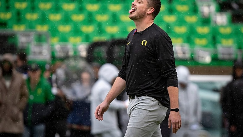 Oregon head coach Dan Lanning sticks his tongue out to catch the rain as the No. 6 Oregon Ducks host California Saturday, Nov. 4, 2023, at Autzen Stadium in Eugene, Ore.
