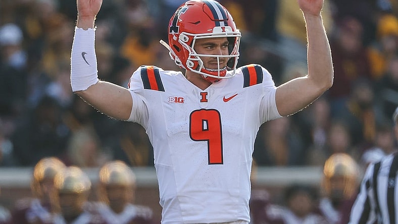 Nov 4, 2023; Minneapolis, Minnesota, USA; Illinois Fighting Illini quarterback Luke Altmyer (9) celebrates his touchdown pass to wide receiver Isaiah Williams (1) during the first half against the Minnesota Golden Gophers at Huntington Bank Stadium. Mandatory Credit: Matt Krohn-USA TODAY Sports